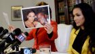 Shantel Jackson: ex-fiancee of Floyd Mayweather jnr looks on as her attorney Gloria Allred holds up a photograph of the couple after announcing a lawsuit against the boxer for battery, assault, invasion of privacy, defamation and false imprisonment. Photograph: Kevork Djansezian/Getty Images