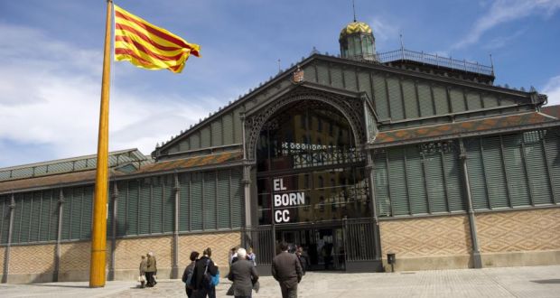 A Catalan flag flutters above Barcelona’s Mercat de Born. Today’s Diada, or Catalan national day, marks the anniversary of city’s  defeat of 1714 during the War of Succession. Photograph: Josep Lago/AFP