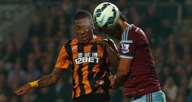 Hull City’s Abel Hernandez  heads the opening goal past West Ham’s James Tomkins  at the KC Stadium. Photograph: Andrew Yates/Reuters. 