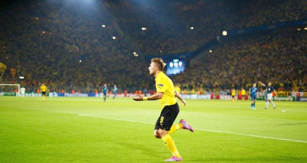 Borussia Dortmund’s Ciro Immobile celebrates after scoring  against Arsenal during their Champions League Group D game. Photograph: Kai Pfaffenbach / Reuters 
