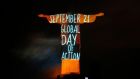 The statue of Christ the Redeemer in Rio de Janeiro is lit up with a message announcing a global mobilisation over climate change – the People’s Climate march, a demonstration to raise awareness about climate change, was held yesterday around the world, in advance of the United Nations Climate Summit tomorrow. Photo: Reuters/Pilar Olivares