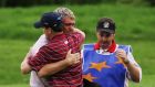 Darren Clarke embraces Zach Johnson after their singles match in 2006 at the K Club as caddie Billy Foster looks on. Photograph: Richard Heathcote/Getty Images.