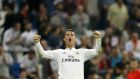 Real Madrid striker Cristiano Ronaldo celebrates after scoring his fourth goal during the midweek victory over Elche at the the Santiago Bernabeu stadium in Madrid. Photograph: Juanjo Martin/Epa