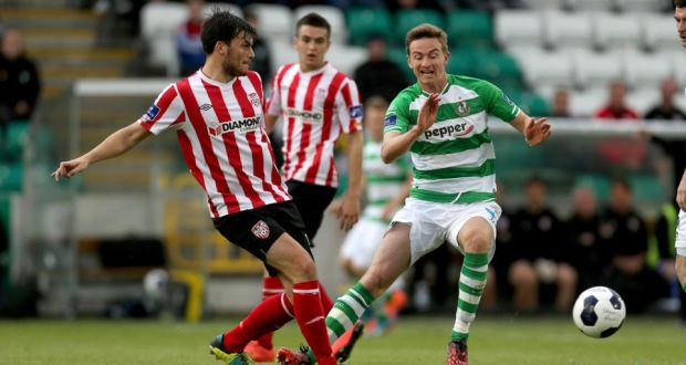 Ronan Finn of Shamrock Rovers and Derry City’s Phillip Lowry during the FAI Cup semi-final at Tallaght Stadium. Photograph: Inpho