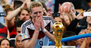 André  Schürrle waits to get his hands on the World Cup last summer.