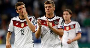  Germany’s Thomas Müller and Toni Kroos   after the Uefa  EURO 2016 qualifying draw with Ireland in Gelsenkirchen. Photograph: Roland Weihrauch / EPA