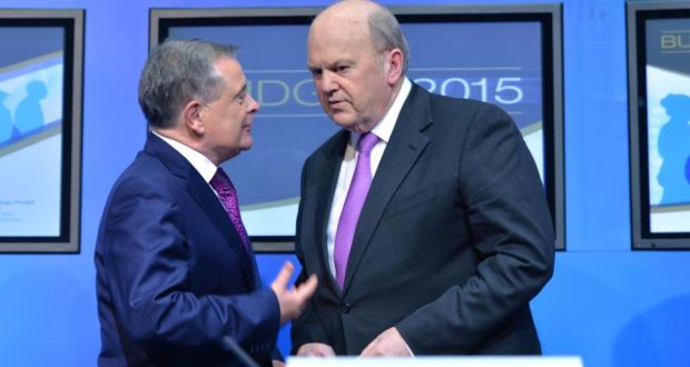 Minister for Public Expenditure and Minister for Finance Michael Noonan  giving a joint Budget 2015 press conference: a return to growth has given them room to manoeuvre. Photograph: Alan Betson