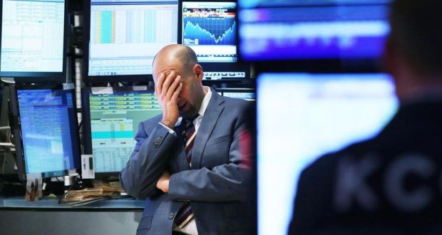 A trader on the floor of the New York Stock Exchange this week. As fears from Ebola and a global slowdown spread, stocks plunged. Photograph: Getty Images