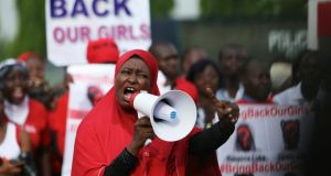 The mass kidnapping sparked protests world-wide. A protester addresses a “Bring Back Our Girls” protest group as they march to the presidential villa to deliver a protest letter to Nigeria’s President Goodluck Jonathan in Abuja, calling for the release of the Nigerian schoolgirls in Chibok who were kidnapped by Islamist militant group Boko Haram. Photograph: Afolabi Sotunde/Reuters
