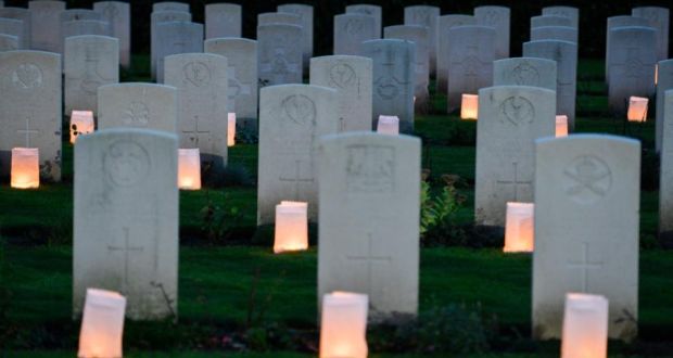 Candles  placed in front of the graves during a first World War centenary commemoration  in Ploegsteert, Belgium, on October 17th . Events commemorating the war are continuing in Belgium and further afield. Photograph: Stephanie Lecocq/EPA