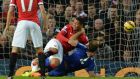  Manchester United’s Chris Smalling  pulls Chelsea’s Branislav Ivanovic  to the ground in the Manchester United penalty area during the  Premier League soccer match  at Old Trafford. Photograph: Peter Powell/EPA