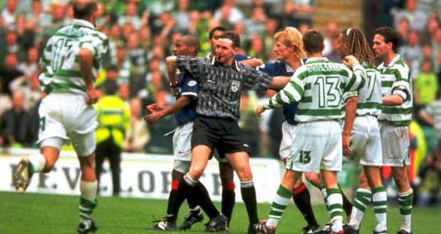 Old school Old Firm:   Referee Hugh Dallas holds back players  after Rod Wallace of Rangers was involved in an fracas   at Celtic Park in 1999. Photograph:  Stu Forster /Allsport