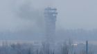 Smoke rises near the traffic control tower of the Sergey Prokofiev International Airport damaged by shelling during fighting between pro-Russian separatists and Ukrainian forces, in Donetsk, eastern Ukraine, today. Maxim Zmeyev/Reuters 