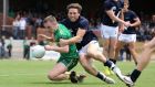Ireland’s Ross Munnelly is tackled by VFL Selection’s Cameron Lockwood during Ireland’s comprehensive victory in the International Rules practice match in Sandringham 