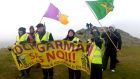  Protesters battle  high winds and rain on Vinegar Hill, while taking part in a protests against pylons and wind turbines, at Enniscorthy, Co Wexford, last January. Photograph: Eric Luke/The Irish Times