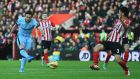 Frank Lampard of Manchester City shoots past Maya Yoshida of Southampton to score their second goal during the Premier League match  at St Mary’s Stadium. Photograph: Shaun Botterill/Getty Images
