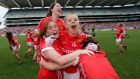 Cork’s Rhona Ní Bhuachalla (left) and Val  Mulcahy (13) and team-mates celebrate   after their remarkable win over Dublin in the 2014 TG4 All Ireland Ladies Senior Football Championship Final, Croke Park, Dublin. Photograph: Ryan Byrne / Inpho