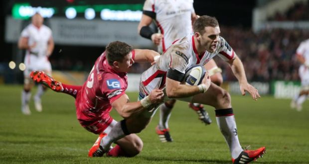 Ulster’s Darren Cave scores a try despite the tackle of Scarlets’ Scott Williams during the European Rugby Champions Cup match at  Kingspan Stadium in Belfast. Photograph:  Darren Kidd/Inpho/Presseye