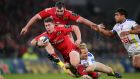 Munster outhalf Ian Keatley, with James Cronin in support, is tackled by Nick Abendanon during Saturday evening’s match at Thomond Park. Photograph: Cathal Noonan/Inpho