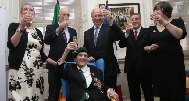 Pat Gillen,  with his children – (left to right) Mary, Robin, Gerard and Patrica – receives the Legion d’Honneur from French Ambassador Jean-Pierre Thebault (centre) at the Mercy Hospital in Cork. Photograph: Niall Carson/PA