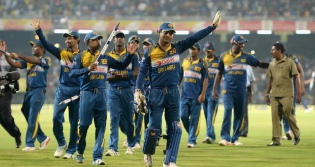 Kumar Sangakkara (right) and Mahela Jayawardena, after his last appearance in Sri Lanka, salute the Colombo crowd following Sri Lanka’s 87-run win over England which secured completed a 5-2 series victory