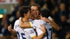 Tottenham Hotspur’s Harry Kane (C) celebrates scoring a goal with Benjamin Stambouli (L) and Andros Townsend during their English League Cup quarter-final win over Newcastle United at White Hart Lane