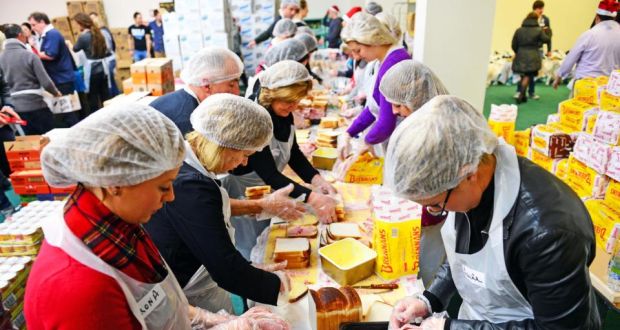 A file photograph of volunteers preparing food and goody bags for distribution, at the annual Christmas Dinner organised by the Knights of  Columbanus. Photograph: Eric Luke/The Irish Times. 