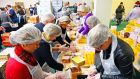 A file photograph of volunteers preparing food and goody bags for distribution, at the annual Christmas Dinner organised by the Knights of  Columbanus. Photograph: Eric Luke/The Irish Times. 