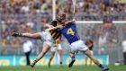  Kilkenny’s Eoin Larkin and Paddy Stapleton of Tipperary collide in the drawn All-Ireland hurling final on September 7th at Croke Park.  Photograph: Ryan Byrne / Inpho