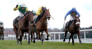  Denis O’Regan on Living Next Door (left) wins the €190,000 Paddy Power Chase at Leopardstown. Photograph: Donall Farmer / Inpho