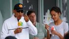 US president Barack Obama enjoys a dessert with his daughter Malia (R) at Island Snow in Kailua, Hawaii on Thursday during his Christmas break. The US has announced sanctions against North Korea in response to its suspected role in the hacking of Sony. Photograph: Gary Cameron/Reuters.