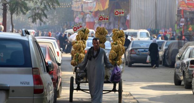 A street vendor sells bananas close to a market in Cairo. Photograph:  Mohamed Abd El Ghany/Reuters 