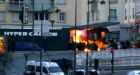 Police detonate flash bangs before raiding the kosher supermarket in Paris where a gunman had held a number of hostages.
