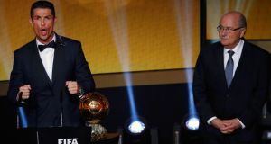 Real Madrid and Portugal forward Cristiano Ronaldo  after receiving the Fifa Ballon d’Or award from Fifa President Joseph Blatter. Photograph: Ruben Sprich / Reuters 