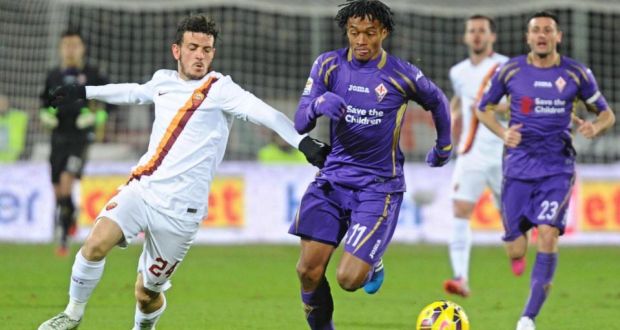 Fiorentina’s Juan Cuadrado in action against AS Roma’s Alessandro Florenzi during the Italian Serie A soccer match between AC Fiorentina and AS Roma. Photograph: Maurizio Degl’ Innocenti