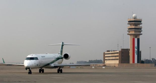 An Iraqi Airways aircraft lands at Baghdad International airport on Tuesday: Airlines from at least three countries suspended flights to Baghdad on Tuesday after bullets hit an aircraft operated by budget carrier Dubai Aviation Corp, known as flydubai. Photograph: Thaier Al-Sudani/Reuters 