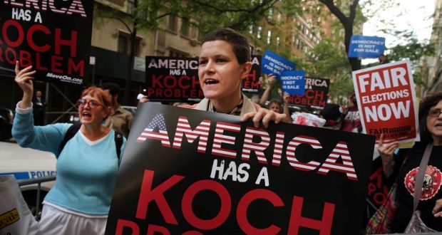 Activists protest near the Manhattan apartment of billionaire and Republican financier David Koch last June in New York City. The demonstrators were protesting against the campaign contributions by the billionaire Koch brothers. Photograph: Spencer Platt/Getty Images