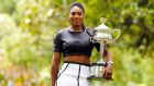 Serena Williams poses with the Daphne Akhurst Memorial Cup after winning the  Australian Open in Melbourne. Photograph: Thomas Peter/Reuters
