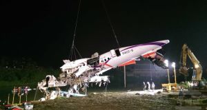 The fuselage of a TransAsia Airways passenger plane being lifted out of the Keelung River in Taipei, Taiwan, 4th February 2015. Photograph: EPA/Military News Agency/Handout