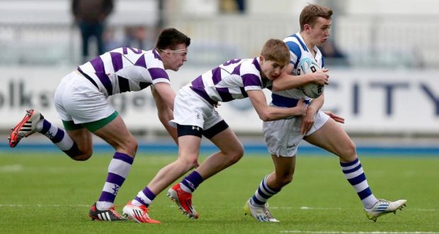 Liam Turner of Blackrock College is tackled by Clongowes Wood players Ben O’Shea and John Durkan in their Leinster Schools Junior Cup first round game at Donnybrook. Photograph: Donall Farmer.