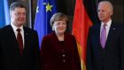  Ukraine president Petro Poroshenko, German chancellor Angela Merkel and US vice-president Joe Biden prior to a Friday meeting of  the Munich Security Conference. Photograph: Matthias Schrader/AP 