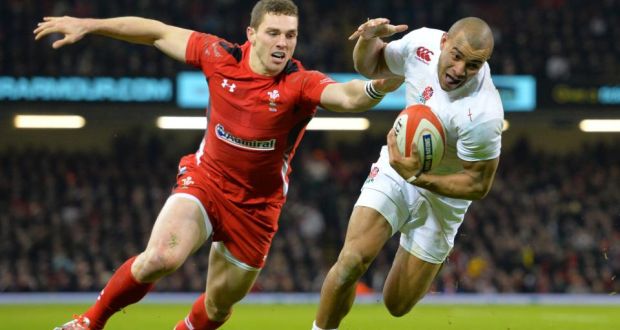 England’s centre Jonathan Joseph  evades the tackle of Wales winger George North to score a try during the Six Nations match at the Millennium Stadium in Cardiff. Photograph: Glyn Kirk/AFP 