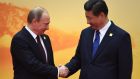 Russia’s president Vladimir Putin with China’s president Xi Jinping: China and Russia will mark their growing closeness with a series of high-level exchanges in coming months, including military parades and joint commemorations of the 70th anniversary of the end of the second World War. Photograph: Greg Baker/AFP/Getty