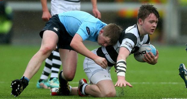 Ruadhan Byron of Belvedere is tackled by Conor Treacy of St Michael’s at Donnybrook. Photograph: Donall Farmer/Inpho