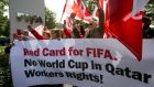 Members of Building and Wood Workers’ International and Swiss Unia unions demonstrate outside Fifa headquarters in 2013. Photograph: Fabrice Coffrini/AFP