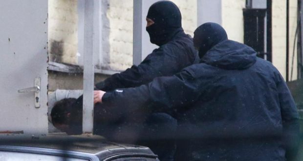 An unidentified suspect (L), detained over the killing of Boris Nemtsov, is escorted while entering a court building in Moscow on Sunday. Photograph: Tatyana Makeyeva/Reuters 