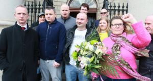Solicitor Cahir O Higgins (extreme left of pic) with water protesters Paul Moore (navy top), Damien O Neill (grey Top) Derek Byrne (white tshirt) and Bernie Hughes (right) pictured after the four jailed protesters were released. Photograph: Collins