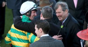 Jamie Codd celebrates with JP McManus and trainer Gordon Elliott after winning on Cause of Causes  Photograph: INPHO/Dan Sheridan