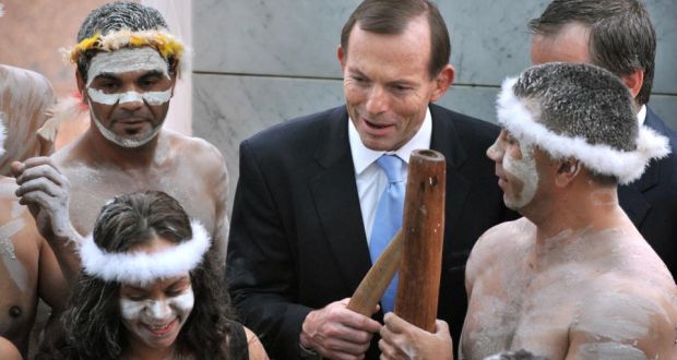 Australia’s prime minister Tony Abbott speaking to Aboriginal performers. Mr Abbott has been criticised for saying Aborigines living in remote settlements are making a “lifestyle choice”. File photograph: Mark Graham/AFP/Getty Images