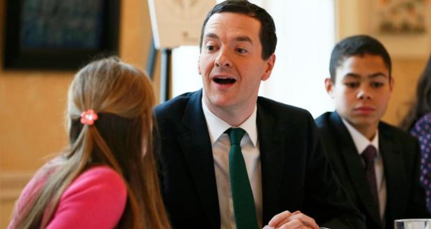 Britain’s chancellor of the exchequer, George Osborne, speaks with children who entered a competition to design the new pound coin, at 11 Downing Street today. Photograph: Stefan Wermuth/Reuters